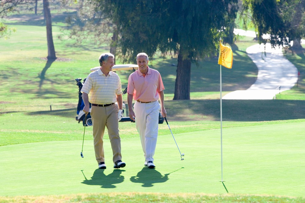 two senior men on the golf course at freedom plaza in sun city center fl