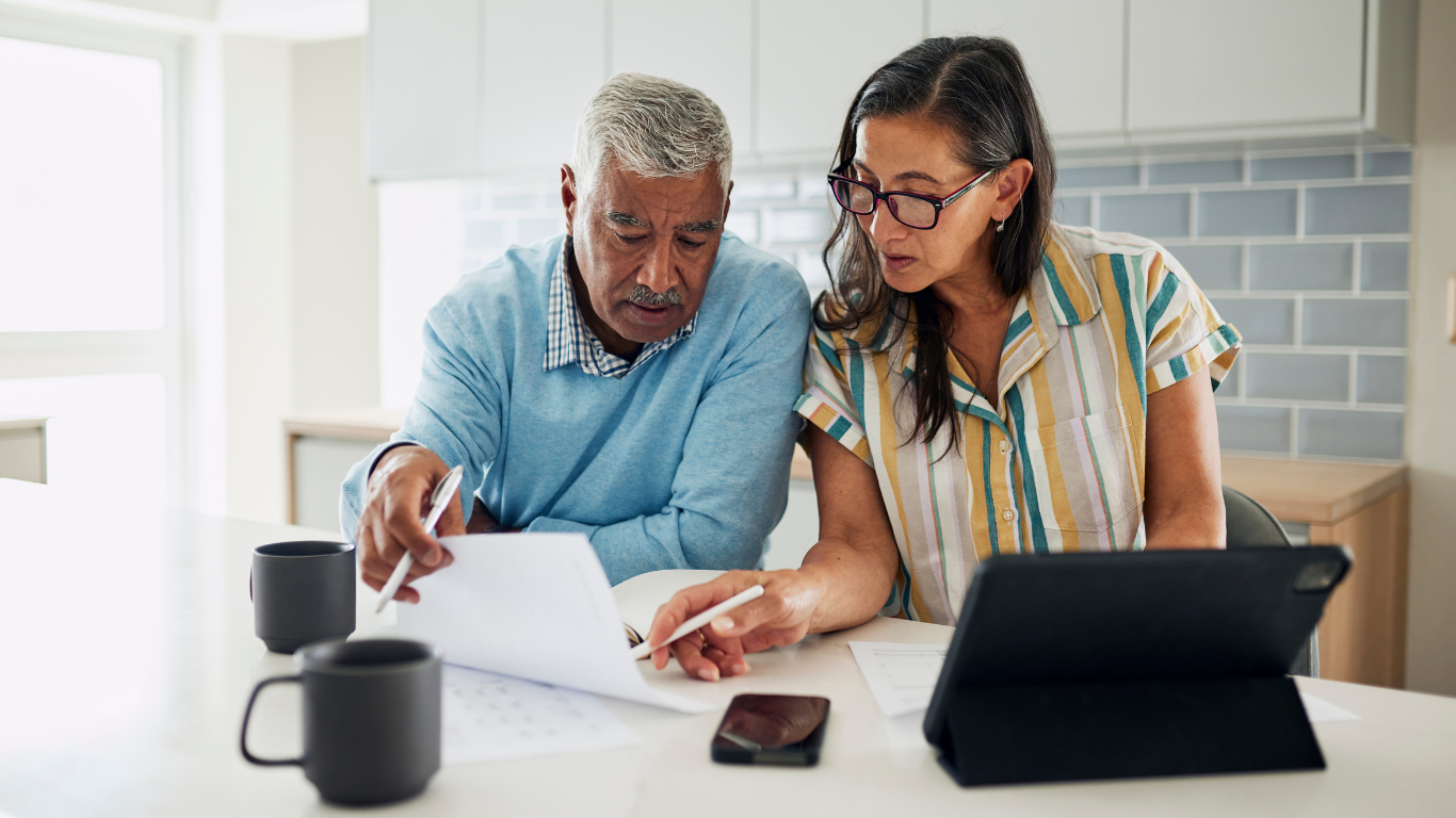 Senior couple looking at paperwork together