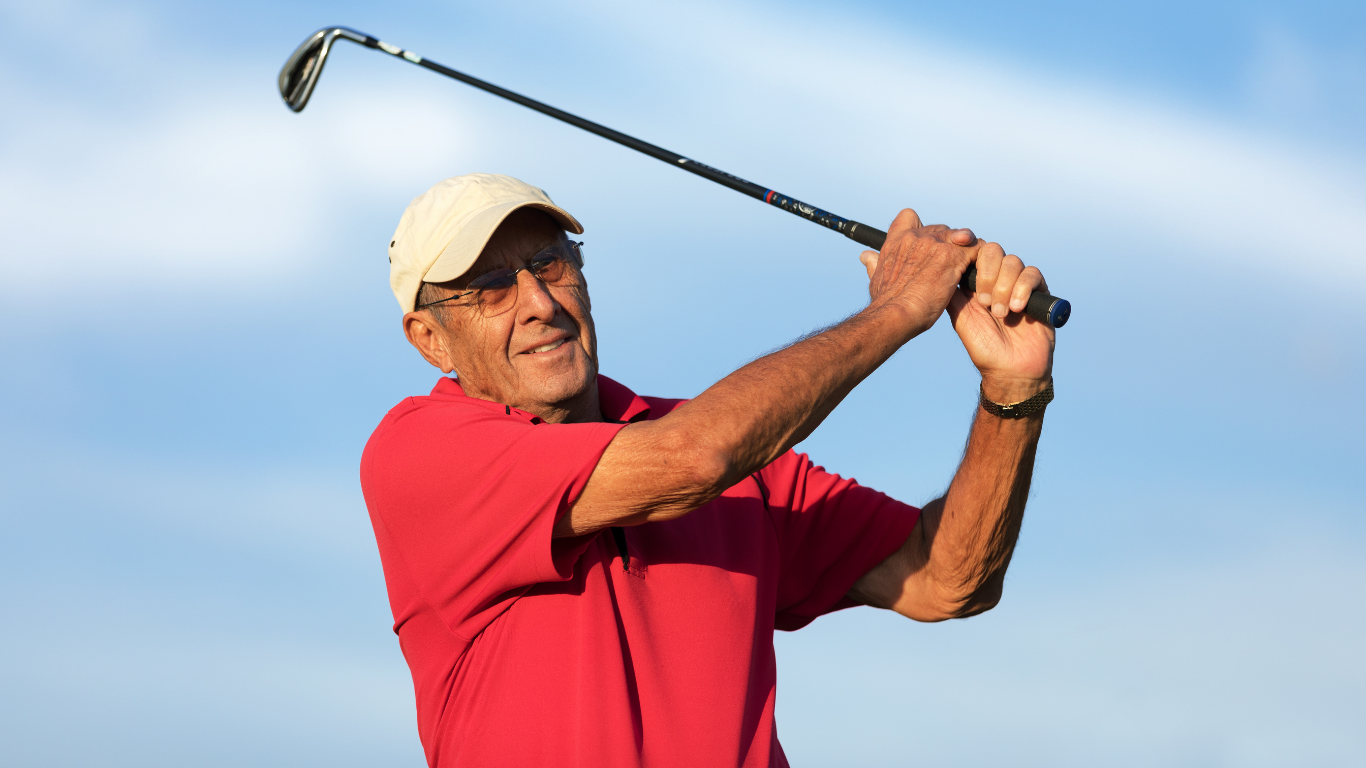 Senior man playing golf