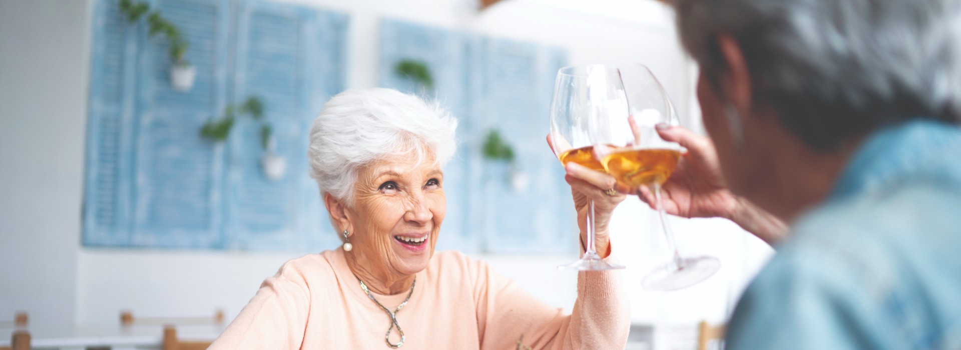 friends saying cheers with a glass of wine