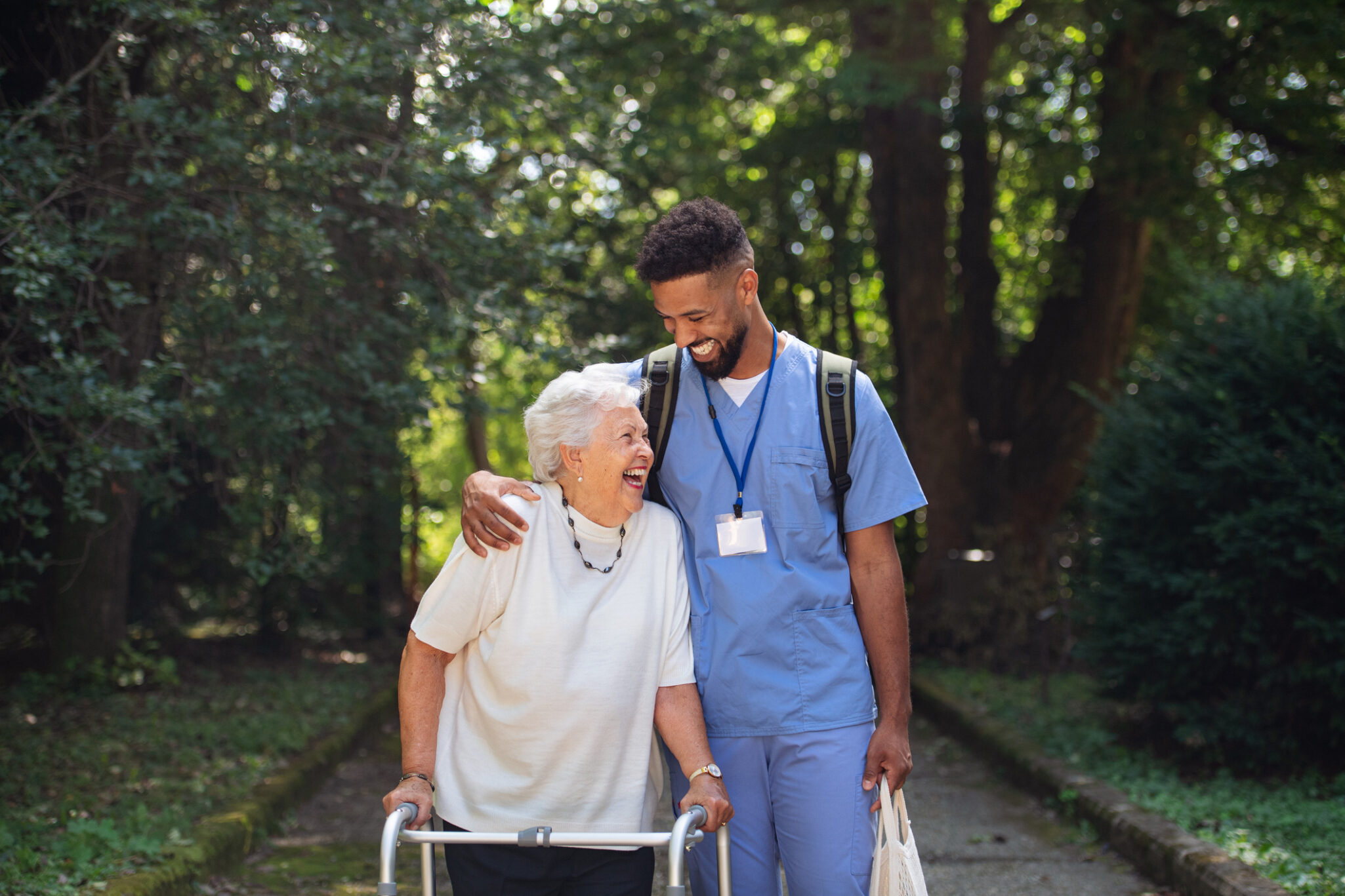 happy senior lady smiling with a male healthcare worker