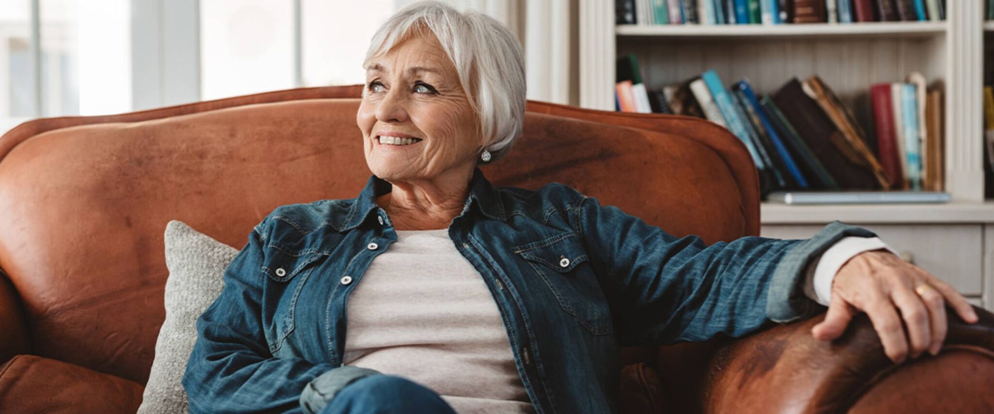 elderly woman sitting and relaxing on the couch