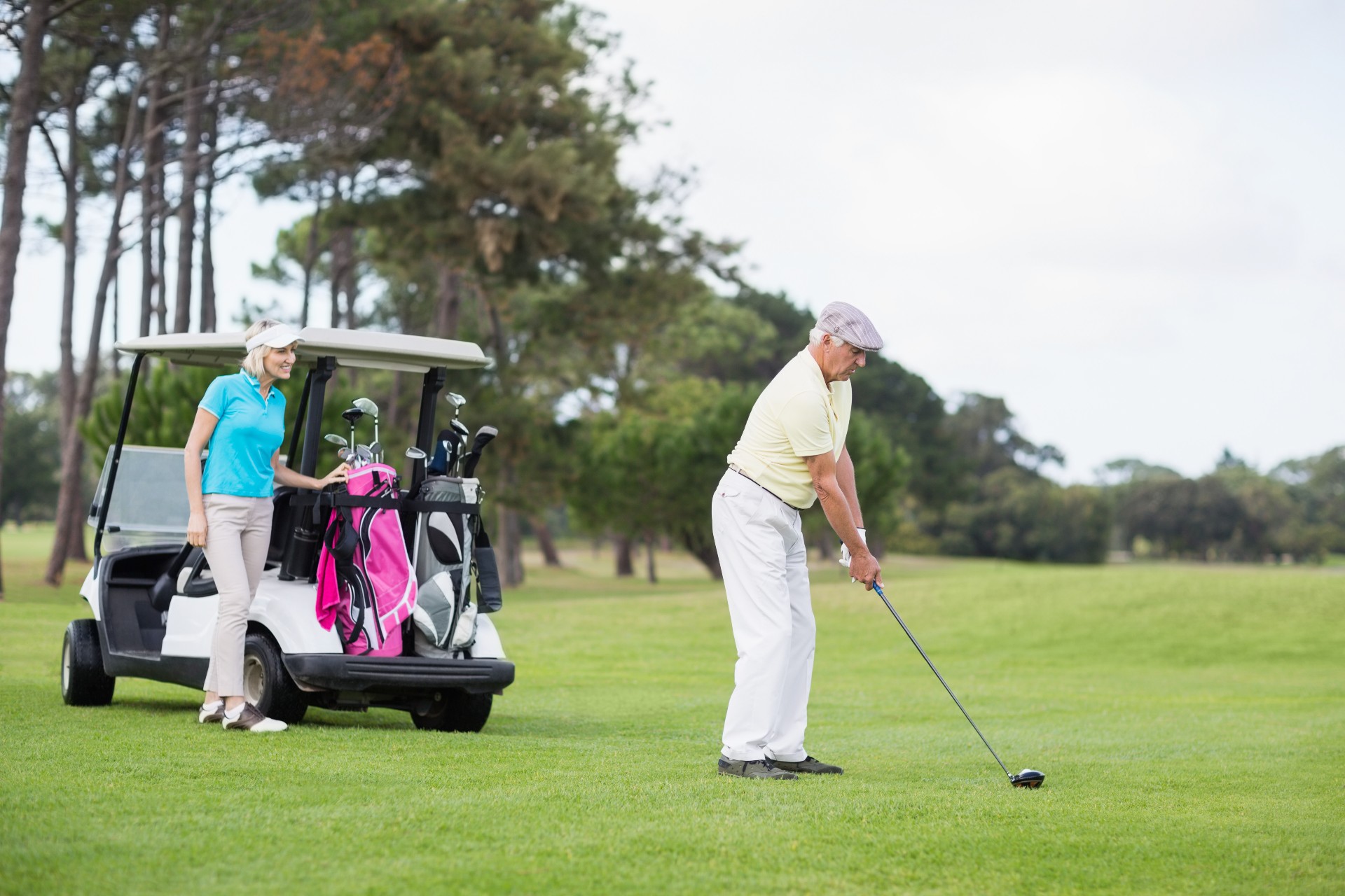 Senior couple playing golf together