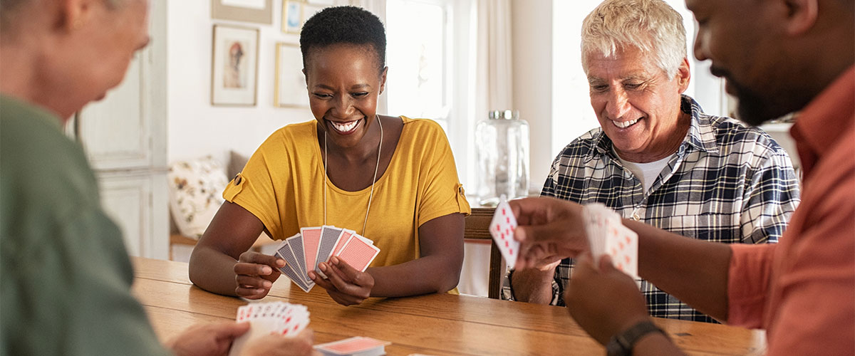 Seniors playing card games together